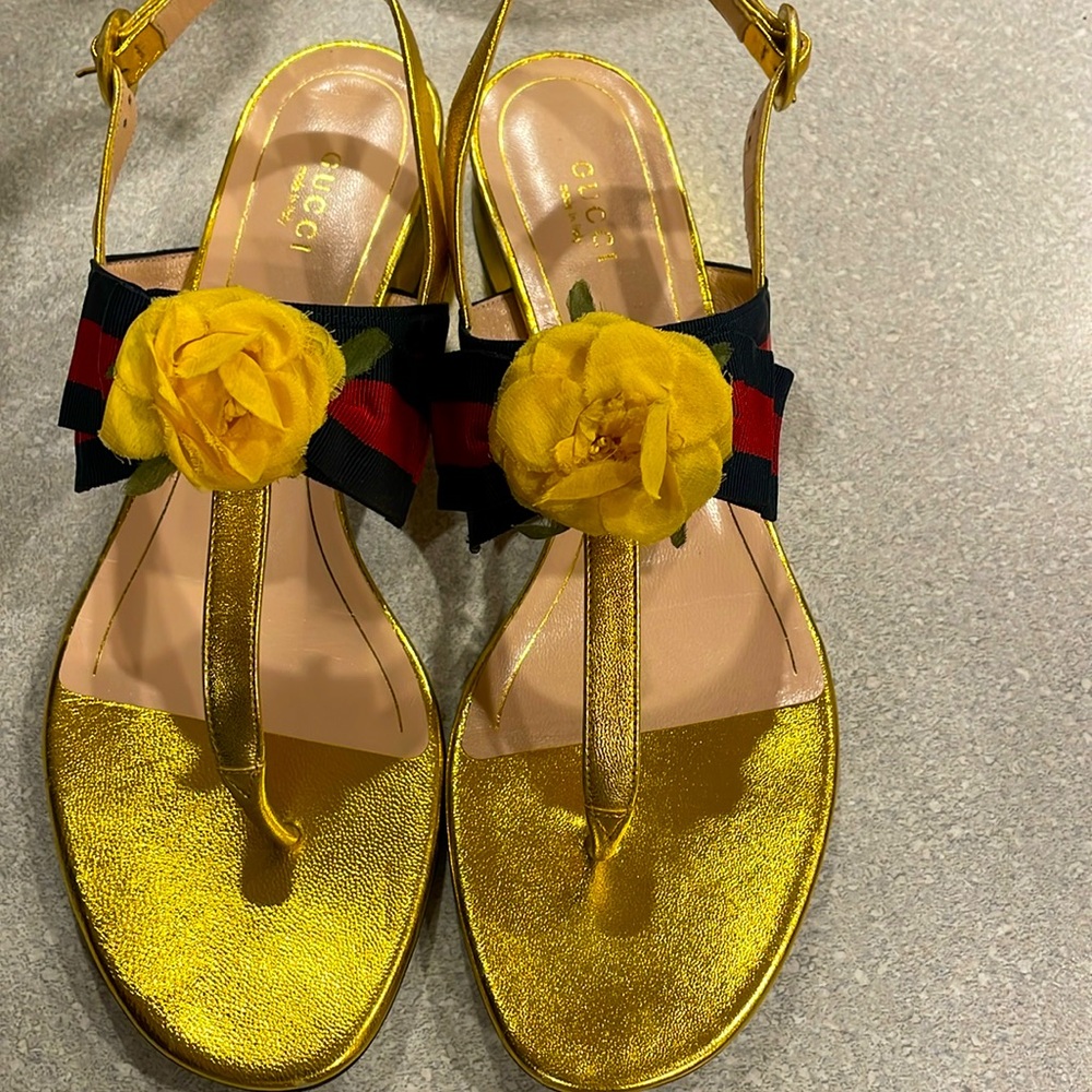 Gucci gold sandals with 1 inch heel.